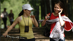 Two girls walking in a park